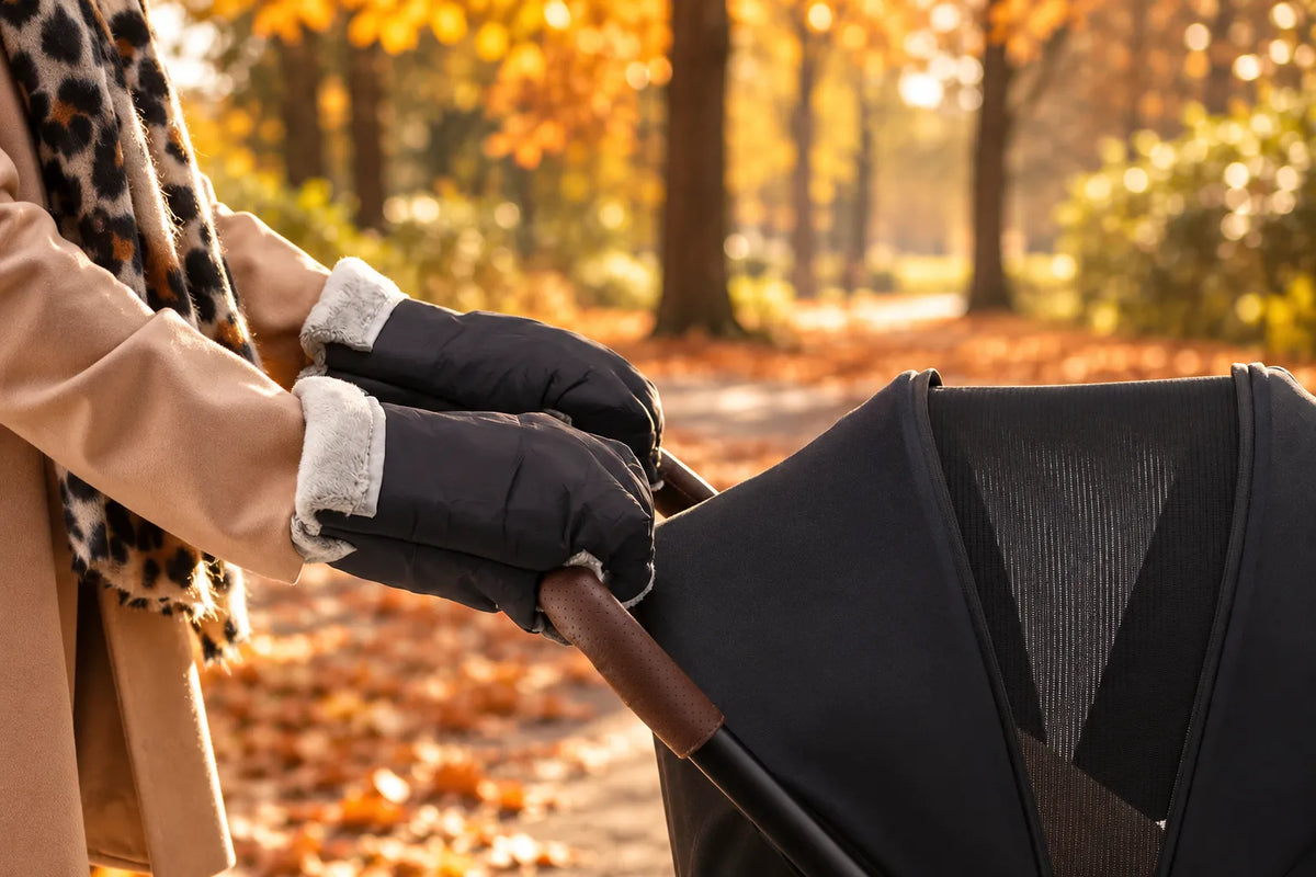 DERYAN Hand warmers in use during a walk through a picturesque autumn park