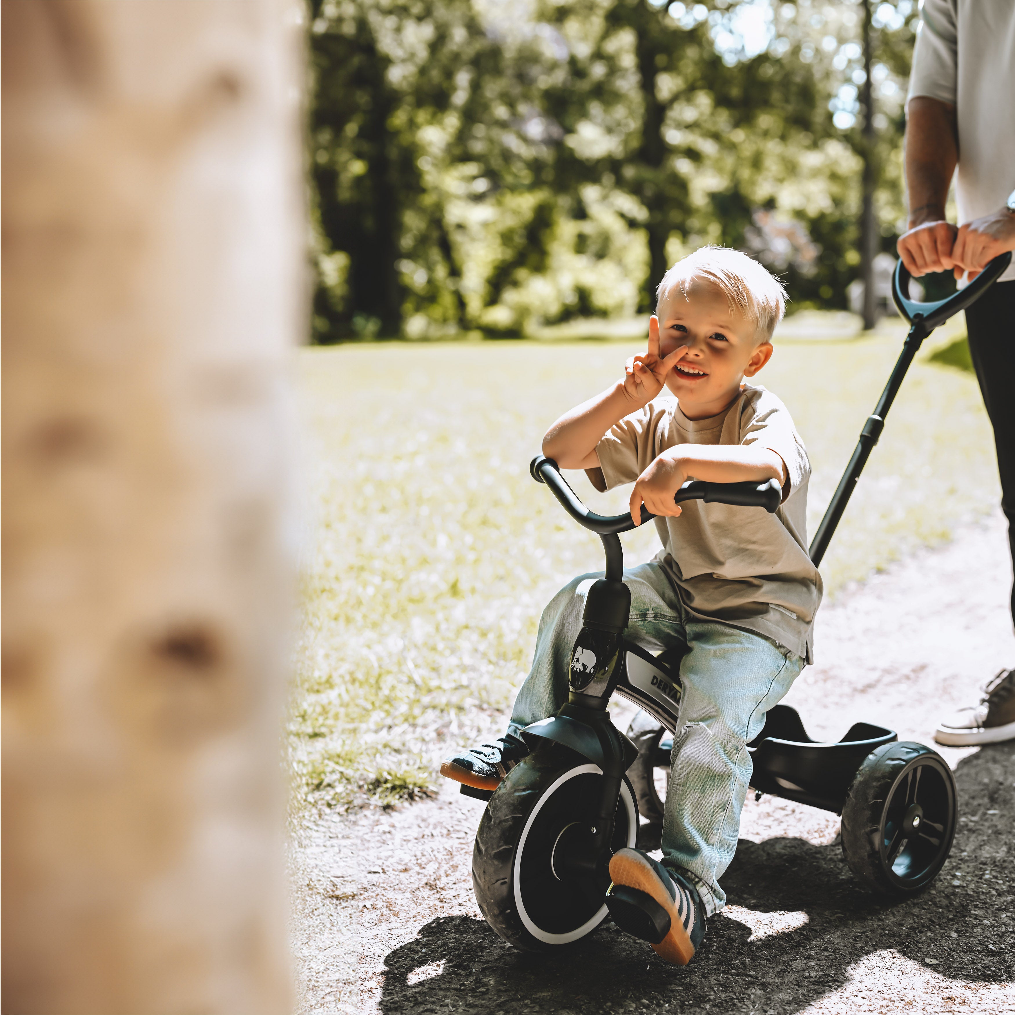 Tricycle with push bar
